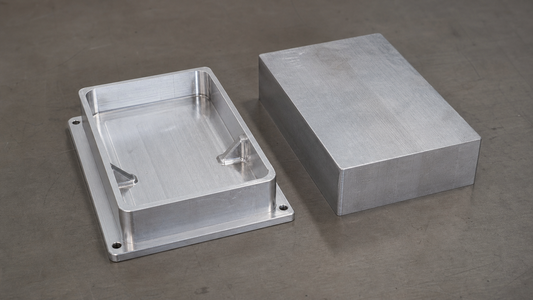 CNC-machined aluminum enclosure with thin walls, ribs, and a thicker base flange